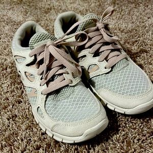 A light tan color with light pink laces. Size 7.5